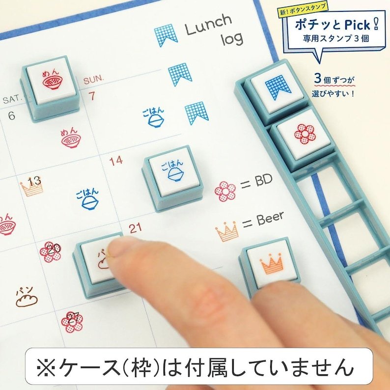 Kodomo no Kao Pochitto Pick push-button stamps marking a planner with noodle, rice, flower and crown icons